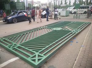 Angry protesters pull down NASS gates